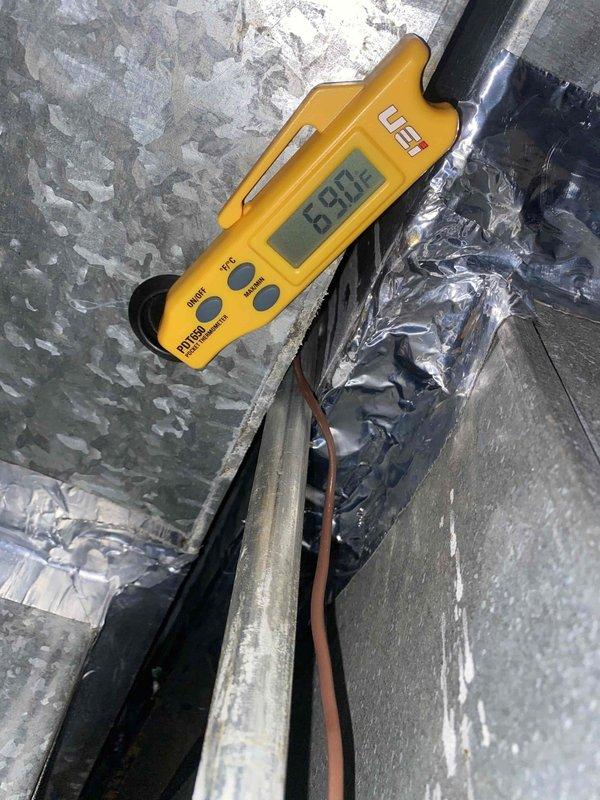 Responded to no cooling complaint on outdoor unit U10 located at back of residence. Upon arrival, found evaporator coil completely frozen with heavy ice accumulation. Measured supply air temperature at 61.9°F and return line temperature at 86.3°F, confirming restricted airflow condition. Instructed to turn off AC unit and leave fan running to allow coil to thaw completely. Return line showed signs of corrosion and oxidation requiring future attention. System requires follow-up visit after defrost cycle to diagnose root cause of freeze-up, which may include low refrigerant charge, dirty air filter, blocked return air, or failed blower motor.
