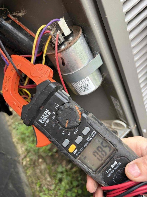 Completed preventive maintenance tune-up on residential HVAC system. Performed comprehensive electrical diagnostics using clamp meter, recording amperage readings of 81.3A and 33A on motor and capacitor circuits to verify proper system operation. Inspected all electrical connections, tested capacitor functionality, and confirmed all components operating within manufacturer specifications for outdoor condensing unit.