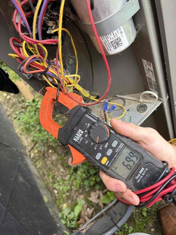 Completed preventive maintenance tune-up on residential HVAC system. Performed comprehensive electrical diagnostics using clamp meter, recording amperage readings of 81.3A and 33A on motor and capacitor circuits to verify proper system operation. Inspected all electrical connections, tested capacitor functionality, and confirmed all components operating within manufacturer specifications for outdoor condensing unit.