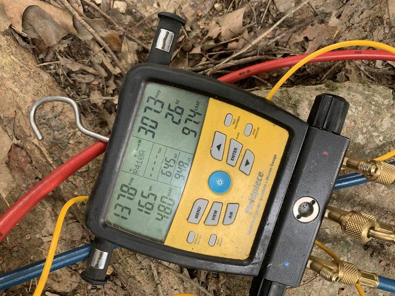 Responded to no cooling complaint on 12-year-old residential air conditioning system. Upon arrival, utilized digital manifold gauges to diagnose system performance and measure refrigerant pressures and temperatures. Testing revealed issues requiring attention to the condensate drainage system. Addressed condensate line concerns by clearing blockage and ensuring proper drainage flow, positioning collection bucket to manage water removal during service. System evaluated for proper operation following repairs to restore cooling capacity to the home.