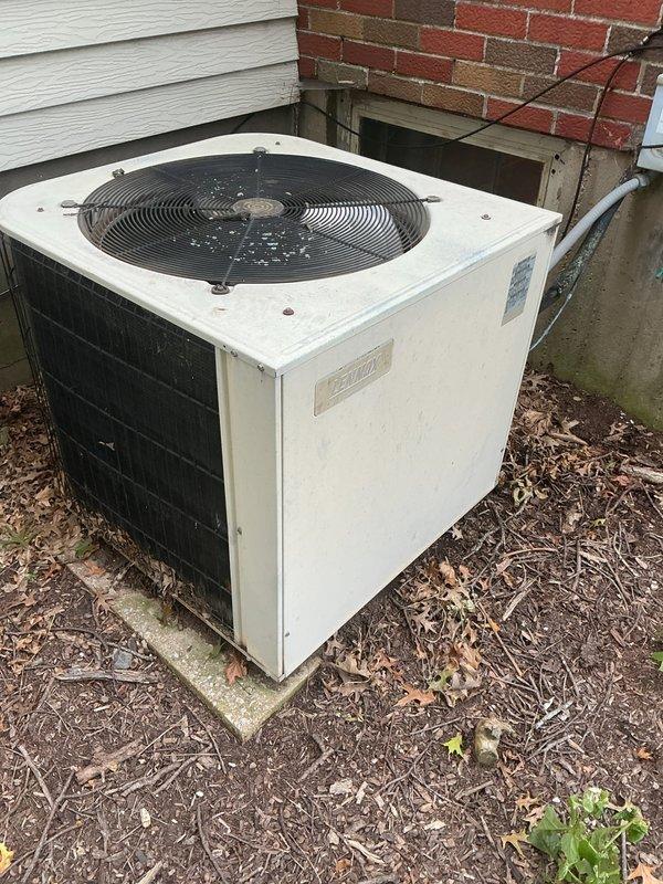 Responded to no cooling complaint on residential split system. Upon arrival, advised customer to power down outdoor condenser unit and leave indoor air handler fan in circulation mode to allow adequate thaw time for suspected frozen evaporator coil. Documented exterior condenser unit condition showing normal weathering and confirmed indoor furnace/air handler installation in basement. System requires minimum 6-8 hours off-cycle with fan circulation to fully defrost before further diagnostics can be performed. Customer instructed on proper thaw procedure and scheduled for follow-up service call after 10 am to allow sufficient defrost time and complete diagnostic evaluation of airflow restrictions, refrigerant charge, and potential causes of coil icing.