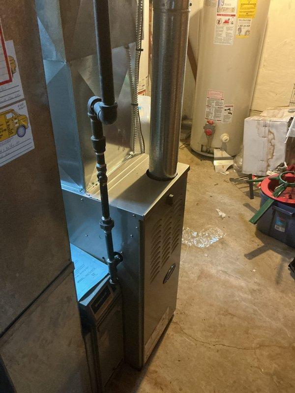 Responded to no cooling complaint on residential split system. Upon arrival, advised customer to power down outdoor condenser unit and leave indoor air handler fan in circulation mode to allow adequate thaw time for suspected frozen evaporator coil. Documented exterior condenser unit condition showing normal weathering and confirmed indoor furnace/air handler installation in basement. System requires minimum 6-8 hours off-cycle with fan circulation to fully defrost before further diagnostics can be performed. Customer instructed on proper thaw procedure and scheduled for follow-up service call after 10 am to allow sufficient defrost time and complete diagnostic evaluation of airflow restrictions, refrigerant charge, and potential causes of coil icing.