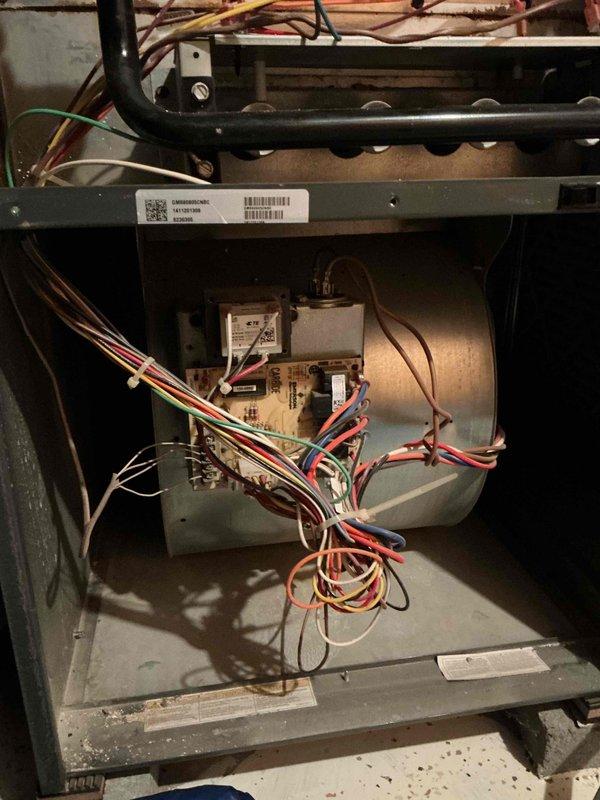 Completed comprehensive cooling system tune-up on residential air conditioning unit located at side of home. Performed standard maintenance procedures including inspection of gas valve, blower motor assembly, electrical connections, and control board. All colored wiring connections were verified secure, circuit board functionality confirmed, and interior components found operating within normal parameters.