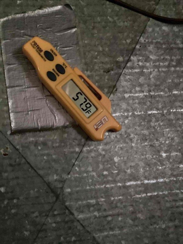 Responded to no cooling call on 10+ year old residential unit located in side yard. Upon arrival, found outdoor condenser unit not operating. Diagnosed failed capacitor preventing compressor and condenser fan motor from starting. Replaced defective capacitor with new unit, restoring proper operation to cooling system. Verified system startup, confirmed compressor engagement, and measured supply air temperature at 57.8°F, indicating adequate cooling performance. Unit operating within normal parameters at time of departure.
