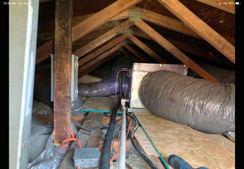 Responded to service call for AC unit leaking in attic with visible water damage on ceiling. Upon inspection, located air handler unit in attic space and identified active leak from condensate drainage system. Inspected condensate drain line, PVC piping, and drain pan for blockages or failures. Cleared obstruction from drain line, verified proper drainage flow, and tested system operation to ensure leak was resolved. Unit operational with no further water discharge detected.