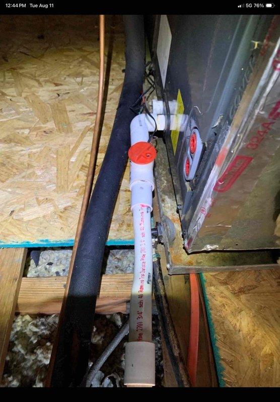 Responded to service call for AC unit leaking in attic with visible water damage on ceiling. Upon inspection, located air handler unit in attic space and identified active leak from condensate drainage system. Inspected condensate drain line, PVC piping, and drain pan for blockages or failures. Cleared obstruction from drain line, verified proper drainage flow, and tested system operation to ensure leak was resolved. Unit operational with no further water discharge detected.