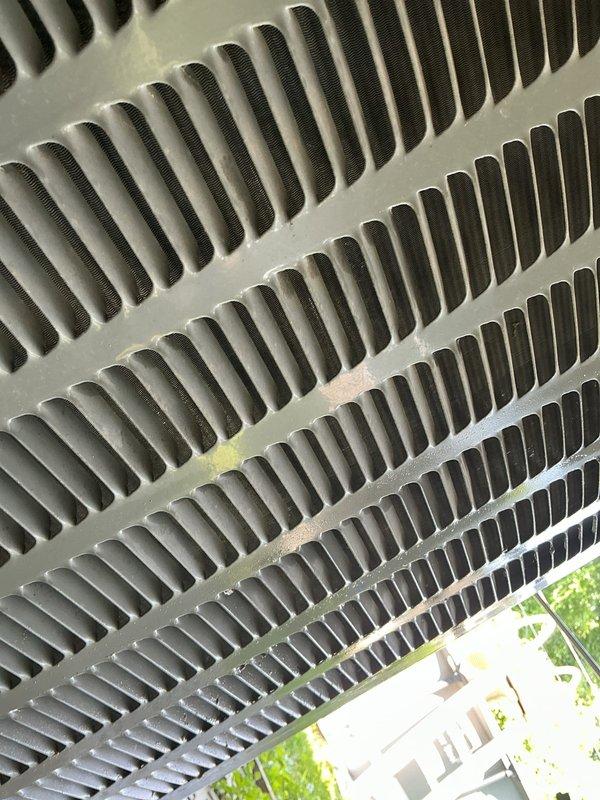 Responded to no cooling complaint on outdoor unit U10. Upon arrival, confirmed air handler fan operational but system not producing cold air. Inspected evaporator coil and found significant dirt and debris accumulation restricting airflow through fins. Coil showed no signs of freezing or frost formation as initially reported. Documented coil condition with photos showing heavy dust buildup in corrugated fin sections. Cleaned evaporator coil thoroughly to restore proper heat exchange and airflow. Verified system operation after cleaning, with unit now cooling properly and achieving target temperatures.