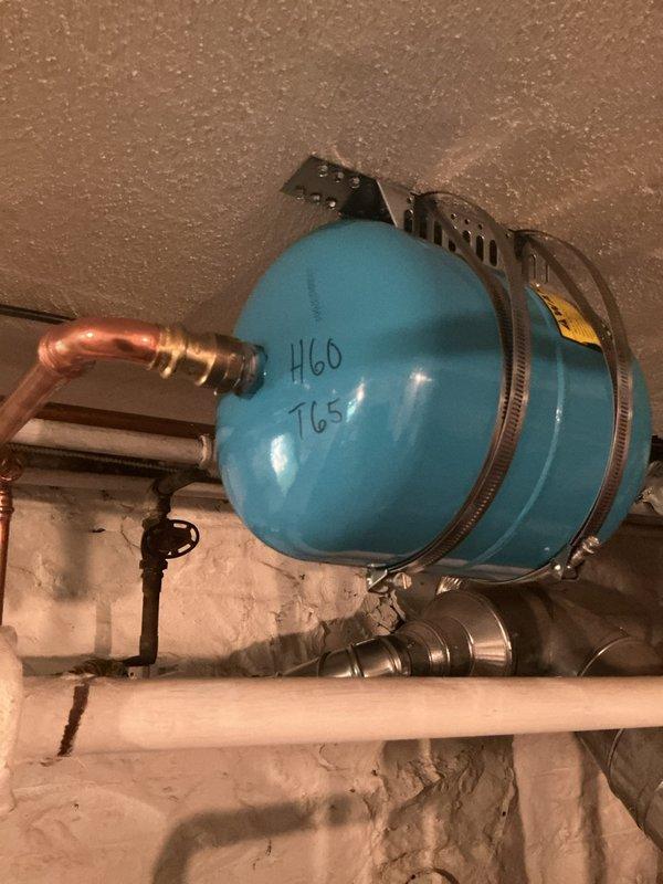Installed 40-gallon State ProLine gas water heater in basement utility area as warranty upgrade replacement. Connected copper supply and discharge piping with appropriate shutoff valves and fittings to existing plumbing system. Verified proper integration with existing blue pressure tank and PVC drainage lines. All connections secured and tested for proper operation per manufacturer specifications.