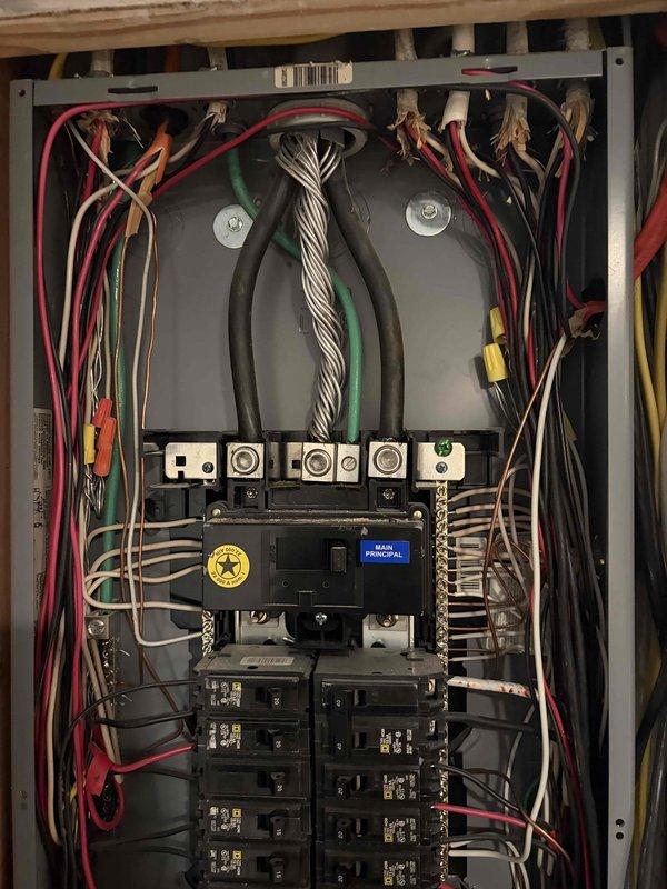 Responded to reported power outages and flickering lights at residential property. Performed comprehensive inspection of electrical service panel, including main breaker, branch circuit breakers, service entrance conductors, and all panel connections. Verified proper torque on all terminal connections, inspected for signs of overheating or arcing, and confirmed proper operation of main and branch circuit breakers. All circuits tested and found operational with no loose connections or damaged components identified.