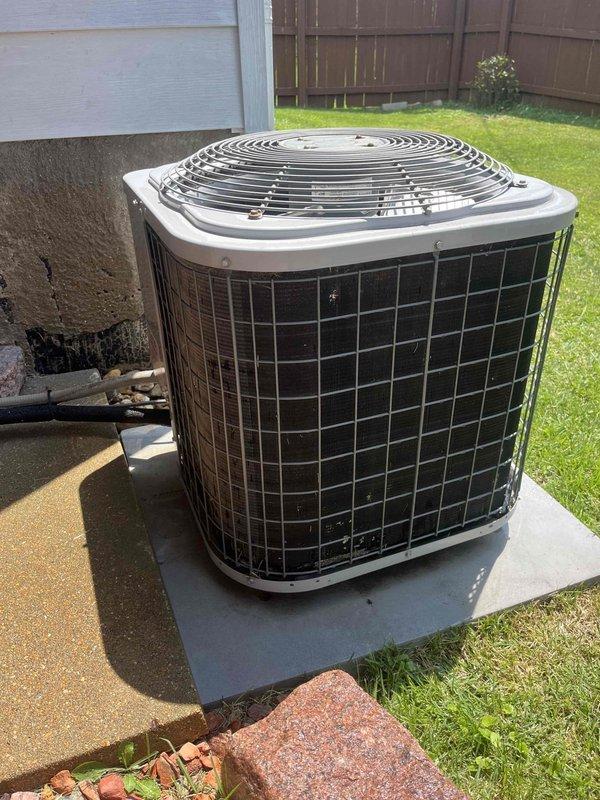 Responded to no-cool call for residential split system reported to be blowing warm air. Upon arrival, performed diagnostic evaluation of outdoor condenser unit located on concrete pad in backyard and inspected electrical panel. Advised customer to keep system off to prevent further damage or compressor failure until repairs could be completed. Documented equipment conditions with photos showing condenser unit exterior and main electrical panel with circuit breakers for future reference and repair planning.