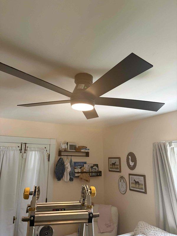 Responded to recall notice for recently installed ceiling fan exhibiting structural instability and mounting concerns. Upon inspection, found flush-mount ceiling fan in interior room showing signs of improper installation with loose mounting bracket causing unit to lean and separate from ceiling junction box. Removed fan assembly, verified electrical box structural integrity and proper anchoring to ceiling joist. Reinstalled mounting bracket with appropriate hardware, ensuring secure connection to support fan weight and operational stress. Reconnected wiring per manufacturer specifications, remounted fan motor housing and blade assembly, and tested unit for stability, balance, and proper operation. Verified all electrical connections at main service panel were secure and properly grounded. Fan now operates safely with no movement or instability detected during testing.