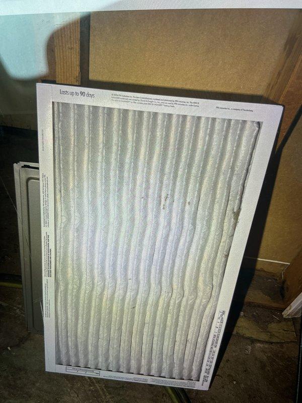 Completed comprehensive cooling system tune-up on ground-level outdoor AC unit located at rear of property. Performed standard maintenance protocol including inspection and testing of electrical components with capacitor readings within normal operating range at 0.054, verified all wire connections secure, and inspected air filter which showed moderate dust accumulation consistent with regular use. System operating efficiently with all components functioning properly.