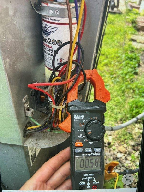 Completed comprehensive cooling system tune-up on ground-level outdoor AC unit located at rear of property. Performed standard maintenance protocol including inspection and testing of electrical components with capacitor readings within normal operating range at 0.054, verified all wire connections secure, and inspected air filter which showed moderate dust accumulation consistent with regular use. System operating efficiently with all components functioning properly.