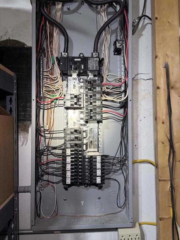 Completed comprehensive electrical inspection of residential service entrance and main distribution panel. Examined exterior meter installation, weatherproof disconnect box, and associated conduit connections serving the property, verifying proper installation and grounding of all exterior electrical components including HVAC equipment connections. Inspected interior main electrical panel, evaluating all circuit breakers, conductor terminations, wire routing, and panel box integrity to ensure compliance with electrical code requirements and safe operation of the electrical system.