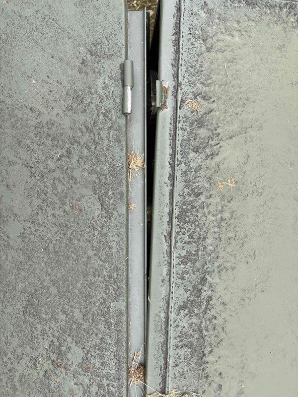 Responded to service call for exterior electrical panel experiencing water intrusion. Upon inspection, identified moisture penetration occurring at concrete joint seam behind panel installation, with visible weathering and debris accumulation around panel mounting area. Panel contained multiple GFCI circuit breakers (15A and 20A ratings) in functional condition. Assessed waterproofing requirements and documented existing conditions including compromised sealing at concrete junction and environmental exposure damage to mounting surface. Provided repair recommendations to address water infiltration issues and prevent future moisture damage to electrical components.