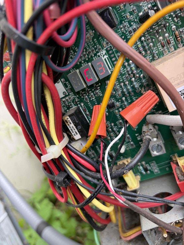 Responded to no cooling complaint on ground-level unit U10. Upon arrival, inspected control board and found faulty circuit board preventing proper system operation. Examined condenser coil fins and verified outdoor unit components were intact. Diagnosed failed control board as root cause of cooling failure and documented system conditions with photos of control board wiring and outdoor unit configuration for warranty and repair documentation purposes.