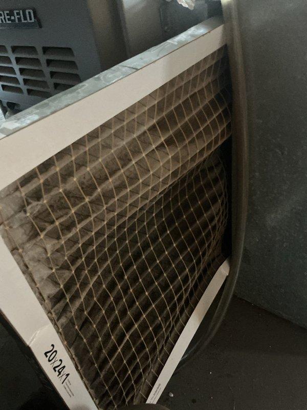 Responded to customer report of squeaking noise from cooling system. Upon inspection, found heavily clogged air filter with significant dust and debris accumulation restricting airflow to the AIREFLO furnace unit. Replaced dirty filter with new filter to restore proper system airflow and eliminate noise issue caused by restricted air movement through the HVAC system.