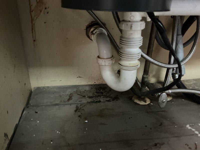 Responded to a clogged kitchen sink drain call. Removed and replaced the existing P-trap assembly with new white PVC piping, installed a cleanout fitting for future maintenance access, and performed cable augering through the drain line to clear the obstruction. The new plumbing configuration provides improved drainage and easier serviceability for any future blockages.