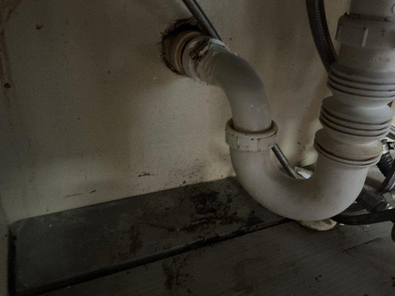 Responded to a clogged kitchen sink drain call. Removed and replaced the existing P-trap assembly with new white PVC piping, installed a cleanout fitting for future maintenance access, and performed cable augering through the drain line to clear the obstruction. The new plumbing configuration provides improved drainage and easier serviceability for any future blockages.