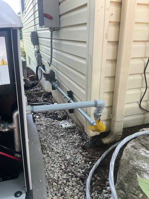 Installed new gas line from exterior meter to generator location. Routed black iron pipe along building exterior with proper support brackets and fittings, including elbows and connections as required by code. Completed interior basement connection with copper transition piping, securing all lines to floor joists and wall surfaces. All work performed to manufacturer specifications and local gas code requirements for standby generator fuel supply.