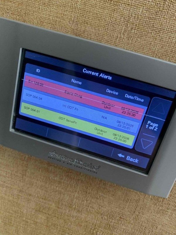 Responded to service call for non-operational air conditioning unit, estimated 10 years old, operating independently from existing Lennox heat pump system. Upon arrival, accessed system control panel and identified multiple active fault codes including communication errors (Conduc Comm), outdoor temperature sensor failures (ODT Sens Fil), and internal outdoor temperature faults (Int: ODT Flt). Documented system alerts and error history via thermostat interface showing timestamps of fault occurrences. Performed diagnostic testing using Fieldpiece digital meter at supply register, recording airflow temperature reading of 54°F. System evaluation revealed critical component failures requiring further assessment of outdoor unit sensors and communication wiring between thermostat and condensing unit.