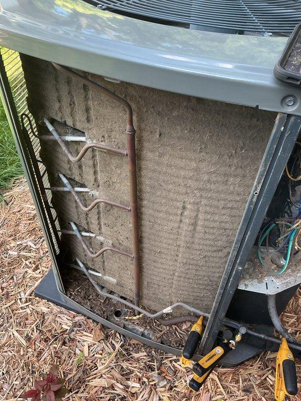 Responded to no cool call on 8-year-old outdoor unit. Upon arrival, found unit with severely clogged and debris-laden filter panel restricting airflow to condenser coil. Removed access panel, inspected refrigerant lines and internal components. Cleaned accumulated dirt and debris from filter media and surrounding compartment. Verified condenser coil fins and refrigerant lines were intact with no visible damage. Restored proper airflow to unit, resolving cooling issue.