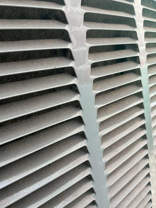Responded to no cool call on 8-year-old outdoor unit. Upon arrival, found unit with severely clogged and debris-laden filter panel restricting airflow to condenser coil. Removed access panel, inspected refrigerant lines and internal components. Cleaned accumulated dirt and debris from filter media and surrounding compartment. Verified condenser coil fins and refrigerant lines were intact with no visible damage. Restored proper airflow to unit, resolving cooling issue.