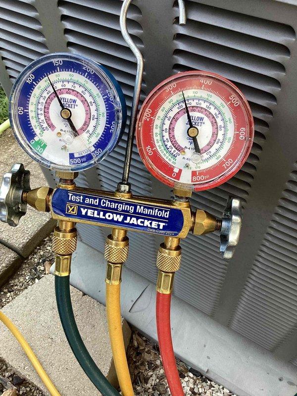 Responded to no cooling complaint on outdoor condensing unit over 10 years old. Connected manifold gauges to service ports to diagnose refrigerant pressures and system performance. Evaluated system operating conditions and documented findings with diagnostic equipment in place for further assessment and repairs.