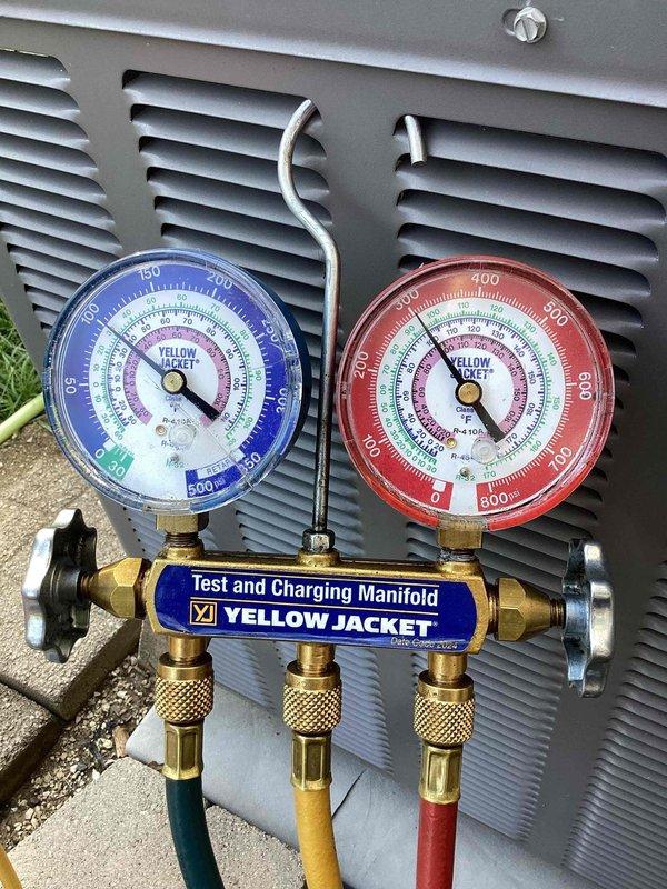 Responded to no cooling complaint on outdoor condensing unit over 10 years old. Connected manifold gauges to service ports to diagnose refrigerant pressures and system performance. Evaluated system operating conditions and documented findings with diagnostic equipment in place for further assessment and repairs.