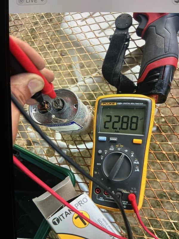 Responded to no cooling call where indoor temperature had risen to 90 degrees while outdoor unit was running. Upon inspection and testing of the outdoor condenser unit, diagnosed failed run capacitor using digital multimeter which confirmed capacitor was out of specification. Replaced defective capacitor with new TITAN PRO unit, restored system to proper operation, and verified cooling cycle resumed normally with air handler and condenser functioning correctly.