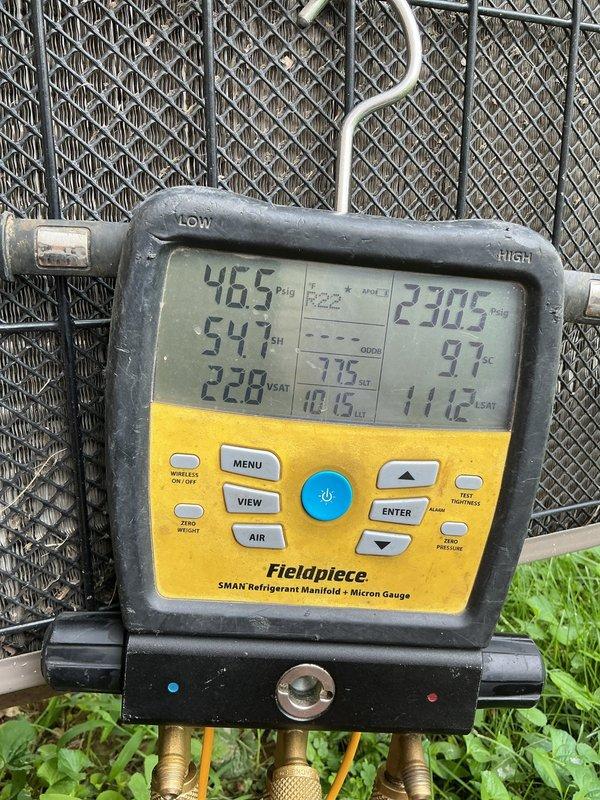 Responded to no cooling complaint on 10+ year old residential AC unit located at side of home. Upon arrival, confirmed unit was blowing warm air with suspected low refrigerant charge. Connected Fieldpiece SMAN manifold gauges to service ports and performed system pressure diagnostics. Readings indicated abnormal operating pressures with high superheat of 54°F and subcooling of 11.6°F, confirming significant refrigerant undercharge. Inspected accessible refrigerant lines and evaporator coil area for potential leak sources. System was shut down per customer request pending approval for leak detection service and refrigerant recharge repairs.