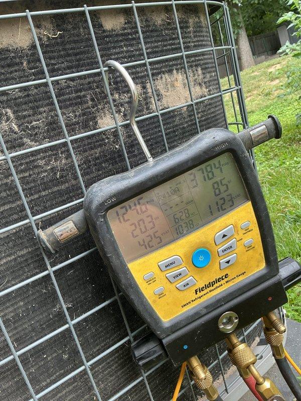 Responded to no cooling complaint for upstairs unit 10 located in backyard. Upon arrival, performed diagnostic evaluation and found condenser coils heavily soiled with dirt and debris accumulation, restricting airflow and reducing heat transfer efficiency. Measured system temperatures and pressures using digital manifold gauges, confirming reduced cooling capacity due to dirty coil condition. Condensate drain system was also inspected at indoor air handler. Recommended thorough coil cleaning and system maintenance to restore proper cooling operation for upstairs zone.