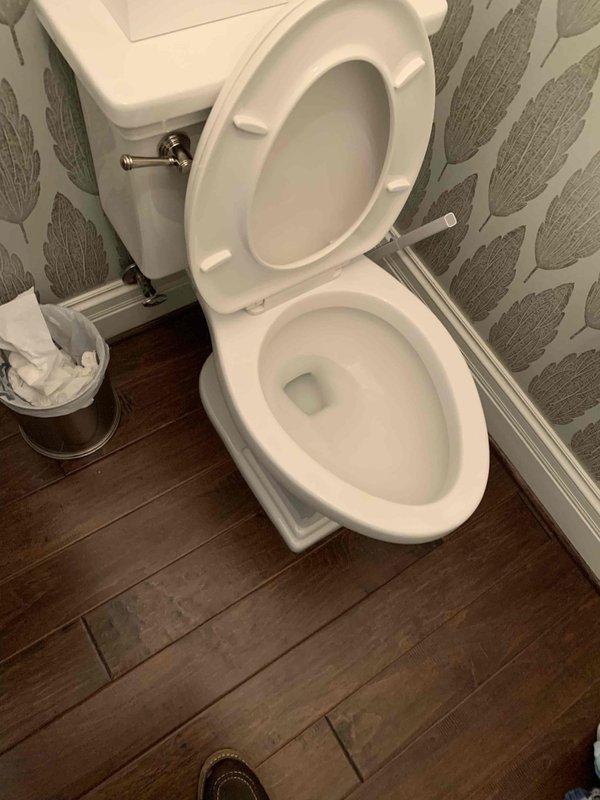 Responded to reported sewer backup affecting first-floor toilet and washing machine drain. Upon inspection, identified clogged main drain line causing wastewater to back up through the plumbing stack into the laundry area. The toilet on the second floor was leaking from the stack connection, indicating pressure buildup in the system due to the blockage. 

Performed diagnostic assessment of the drainage system to locate the obstruction point. Cleared the main sewer line blockage using professional drain cleaning equipment, restoring proper flow and eliminating the backup condition. Verified that wastewater was draining correctly from both the toilet and washing machine discharge line. Inspected the stack connection at the second-floor toilet for any damage from the leak and confirmed proper sealing after clearing the blockage. 

Tested all affected fixtures to ensure complete resolution of the drainage issue and proper system function. Advised on preventative maintenance recommendations