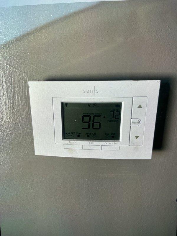 Responded to no cooling complaint on U10 system blowing warm air. Upon arrival, found thermostat displaying 96°F indoor temperature. Performed diagnostic testing on outdoor unit and measured capacitor with multimeter, obtaining reading of 46.4 microfarads, indicating failed capacitor below manufacturer specifications. Identified defective run capacitor as root cause of system failure preventing compressor from operating properly.