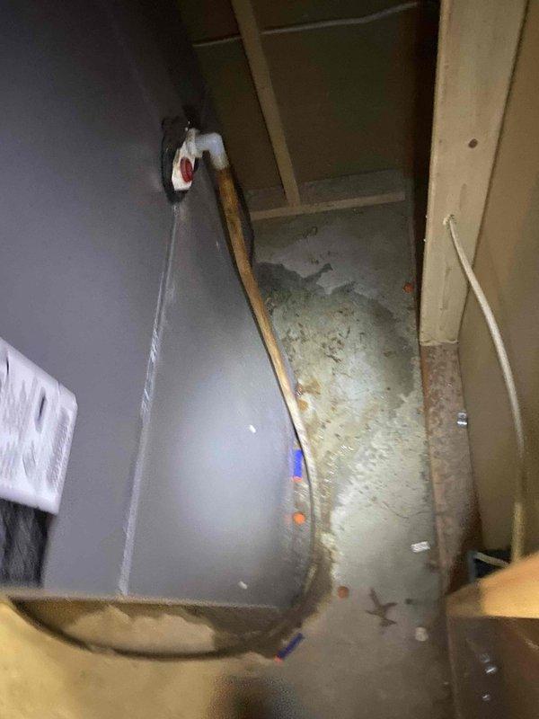 Responded to no-cool service call on 16-year-old residential air conditioning system experiencing active water leakage from indoor unit. Upon arrival, performed diagnostic inspection of air handler and discovered clogged condensate drain line causing overflow and water discharge at base of unit. Cleared blockage from drain line using appropriate tools and verified proper drainage flow. Inspected evaporator coil and drain pan for damage or secondary issues; found drain pan intact but noted accumulation of algae and debris contributing to blockage. Flushed condensate system thoroughly and treated drain line to prevent future biological growth. Tested system operation through complete cooling cycle to confirm proper condensate removal and verified no further leakage present. System restored to normal cooling operation with proper drainage function.