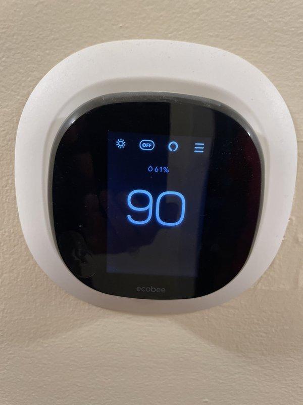 # HVAC Service - No Cool

Responded to service call for 13-year-old residential air conditioning system blowing warm air with no cooling capability. Upon arrival, verified thermostat was set to cooling mode at 90°F setpoint but system was not producing conditioned air. Proceeded to outdoor condenser unit for diagnostic inspection.

Opened electrical access panel on ground-level condenser unit and performed comprehensive visual and electrical assessment of internal components. Inspected capacitor, contactor, and associated wiring harnesses for signs of failure, damage, or degradation. Examined all wire connections, terminals, and safety devices for proper seating and continuity. Tested capacitor voltage and microfarad ratings to verify operational parameters were within manufacturer specifications.

Identified failed dual-run capacitor as root cause of no-cool condition. Component showed signs of bulging and tested significantly below rated capacitance values, preventing compressor and 