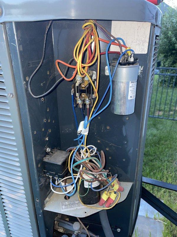 Responded to no cooling complaint on 8-year-old Trane system with thermostat locked at 78°F and no airflow from downstairs vents. Upon inspection, found outdoor unit's dual run capacitor had failed, preventing compressor and condenser fan operation. Replaced defective capacitor, tested contactor operation, and verified all electrical connections in outdoor unit's control compartment. Cycled system through complete cooling cycle, confirmed proper compressor amperage draw, verified adequate airflow at all registers, and restored cooling operation with thermostat responding correctly to temperature setpoints.