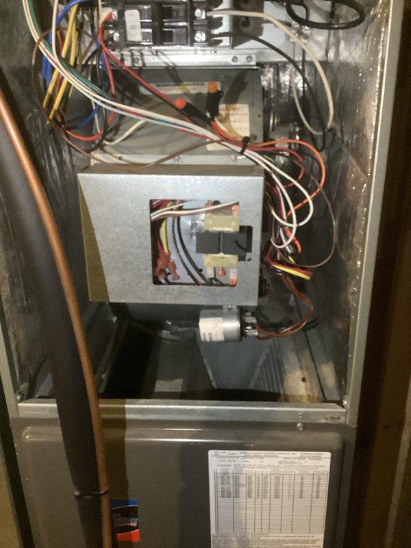 Responded to service call regarding strange chemical odor (Windex-like smell) emanating from basement HVAC unit. Performed comprehensive diagnostic inspection of Unit 010, including visual examination of internal components, electrical connections, and refrigerant lines. Accessed unit cabinet to inspect blower compartment, evaporator coil area, and condensate management system for potential leak sources. Utilized Fieldpiece SMAN refrigerant manifold gauge to measure system pressures and temperatures, verifying refrigerant charge levels and checking for signs of refrigerant leakage that could produce chemical odors. Inspected all visible copper refrigerant lines, connections, and fittings for oil residue or leak indicators. Examined condensate drain pan and drainage system for standing water, blockages, or microbial growth that may contribute to unusual odors. Verified proper operation of electrical components including contactor, transformer, and control box. Documented system conditio