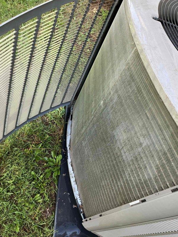 Performed end-of-season cooling tune-up on 2-year-old Lennox heat pump unit. Upon arrival, found significant accumulation of dirt, debris, pollen, and organic matter on both condenser coil and heat exchanger panels, with visible algae and mildew growth restricting airflow through fins. Completed comprehensive system inspection including electrical connections, refrigerant pressures, and operational controls—all parameters within manufacturer specifications with no mechanical issues identified. Thoroughly cleaned condenser coils and heat exchanger fins to remove buildup and restore proper airflow and heat transfer efficiency. Unit is operating properly and ready for continued service.