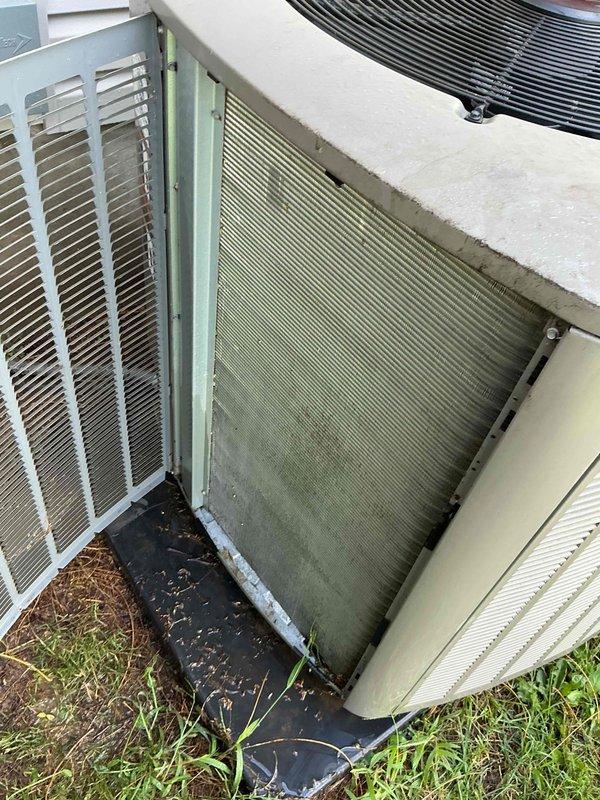 Performed end-of-season cooling tune-up on 2-year-old Lennox heat pump unit. Upon arrival, found significant accumulation of dirt, debris, pollen, and organic matter on both condenser coil and heat exchanger panels, with visible algae and mildew growth restricting airflow through fins. Completed comprehensive system inspection including electrical connections, refrigerant pressures, and operational controls—all parameters within manufacturer specifications with no mechanical issues identified. Thoroughly cleaned condenser coils and heat exchanger fins to remove buildup and restore proper airflow and heat transfer efficiency. Unit is operating properly and ready for continued service.