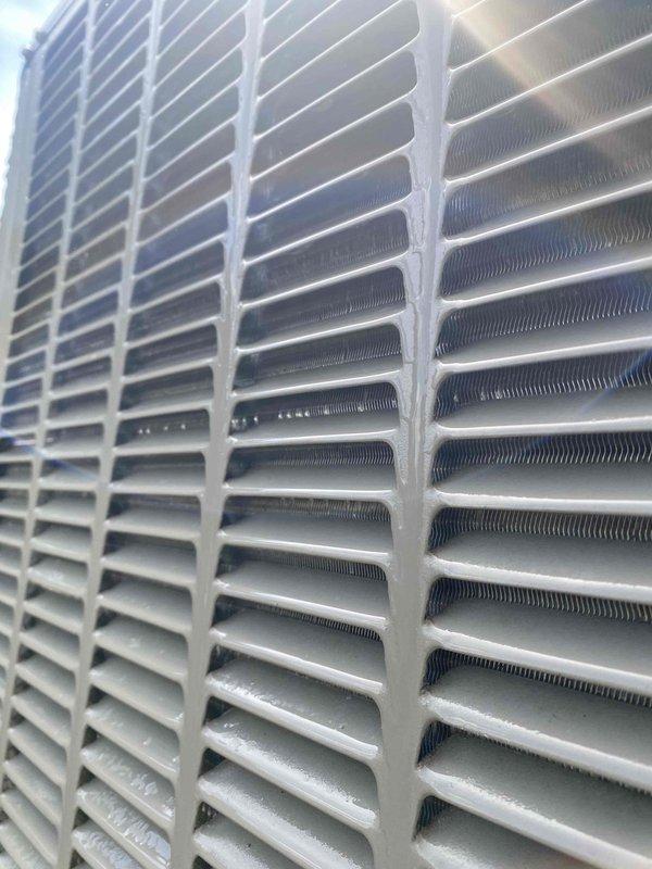 Completed comprehensive cooling system tune-up on outdoor condensing unit. Performed visual inspection of condenser coil and exterior components, verified proper fin condition and cleanliness. Measured and recorded electrical amperage draw of 6.92A on compressor circuit, confirming unit operating within normal parameters.