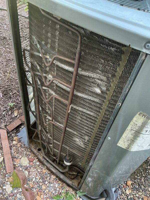 Completed comprehensive end-of-season tune-up on 12-year-old Trane air conditioning system with no reported operational issues. Performed full system inspection including outdoor condenser unit where significant dirt and debris accumulation was observed on coil fins, and indoor blower assembly which showed dust buildup on motor housing and wheel. All standard maintenance procedures were executed including cleaning, component inspection, and operational testing to ensure optimal system performance for continued service.