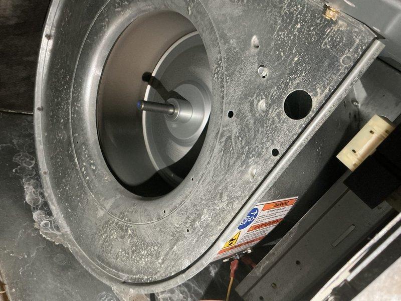 Completed comprehensive end-of-season tune-up on 12-year-old Trane air conditioning system with no reported operational issues. Performed full system inspection including outdoor condenser unit where significant dirt and debris accumulation was observed on coil fins, and indoor blower assembly which showed dust buildup on motor housing and wheel. All standard maintenance procedures were executed including cleaning, component inspection, and operational testing to ensure optimal system performance for continued service.