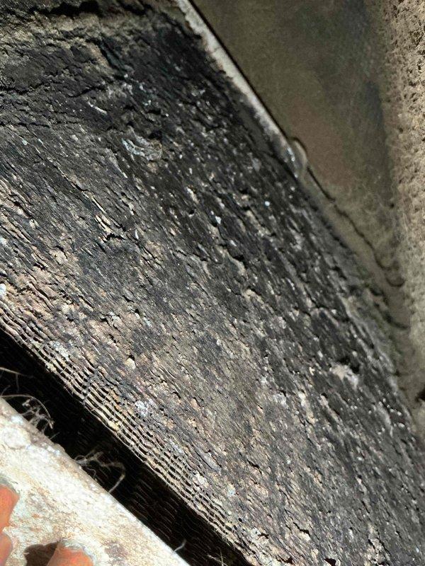 Responded to no cooling complaint on 10-year-old residential system. Upon arrival, unit was shut off per prior instruction. Inspection revealed severely restricted airflow due to heavily contaminated evaporator coil with excessive dust, dirt, and debris accumulation throughout the fin assembly. Outdoor condenser coil also exhibited significant dirt buildup, bent fins, and surface contamination affecting heat transfer efficiency. Documented conditions with photos showing extent of deterioration on both indoor and outdoor coil assemblies. Advised customer that system requires professional coil cleaning and possible fin straightening to restore proper cooling capacity and airflow. Unit left in off position pending customer approval for necessary cleaning services to address restricted airflow conditions preventing adequate cooling performance.