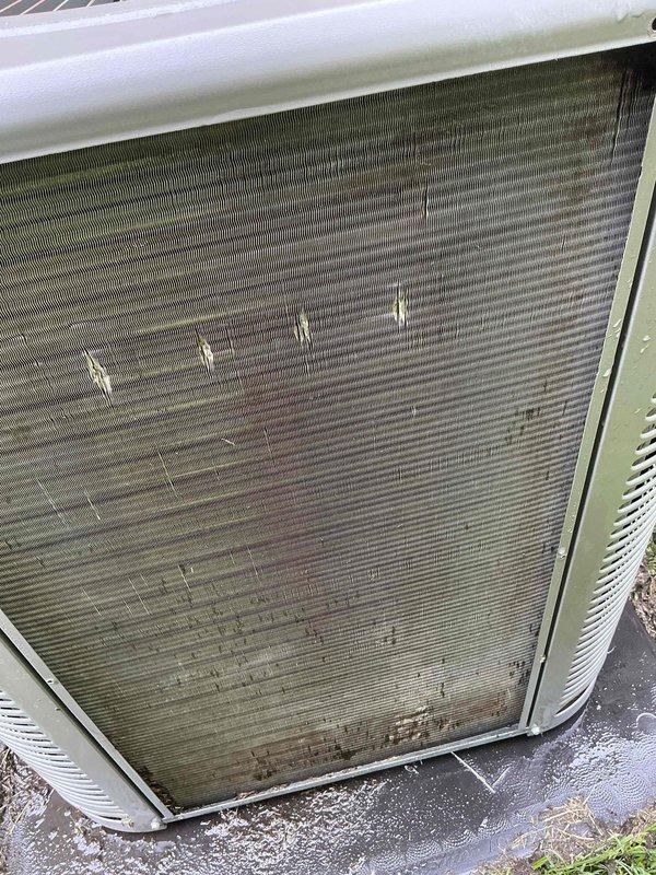 Responded to no cooling complaint on 10-year-old residential system. Upon arrival, unit was shut off per prior instruction. Inspection revealed severely restricted airflow due to heavily contaminated evaporator coil with excessive dust, dirt, and debris accumulation throughout the fin assembly. Outdoor condenser coil also exhibited significant dirt buildup, bent fins, and surface contamination affecting heat transfer efficiency. Documented conditions with photos showing extent of deterioration on both indoor and outdoor coil assemblies. Advised customer that system requires professional coil cleaning and possible fin straightening to restore proper cooling capacity and airflow. Unit left in off position pending customer approval for necessary cleaning services to address restricted airflow conditions preventing adequate cooling performance.