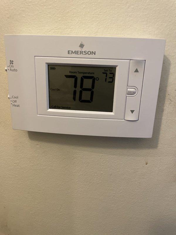 Responded to no cooling complaint on recently installed attic-mounted air conditioning unit with reported water leak. Upon arrival, found thermostat calling for cooling with setpoint of 73°F while space temperature registered 78°F, confirming inadequate cooling performance. Performed diagnostic temperature measurements at supply duct, recording 50°F air temperature. Observed visible moisture damage and staining on ductwork insulation indicating active or previous water leak from air handler. System operational but not maintaining desired temperature setpoint. Documented conditions with thermal readings and photographic evidence for warranty evaluation on unit installed under previous job number.