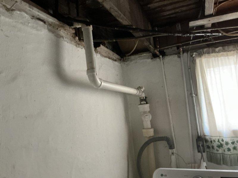 Responded to service call for clogged drains affecting both kitchen and bathroom sinks. Upon arrival, performed diagnostic assessment to determine the nature and location of the blockage within the drainage system. Inspected accessible plumbing infrastructure in the basement utility area, including exposed PVC drain lines and waste piping visible along the walls and ceiling joists. Cleared obstructions from affected drain lines using appropriate drain cleaning equipment and techniques. Verified proper drainage flow was restored to both the kitchen and bathroom sink fixtures. Tested drainage performance to ensure complete resolution of the clogging issue and confirmed all fixtures were draining properly at the conclusion of service.