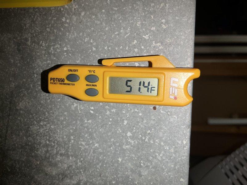 Returned to property for follow-up service call on frozen air conditioning system. Performed diagnostic evaluation of Carrier CVPH series unit that had previously experienced freezing conditions. Measured and documented supply air temperature reading of 51.4°F at supply duct, indicating system is now operating within normal parameters. Verified unit specifications and reviewed equipment data plate information to ensure proper system operation following previous service visit.