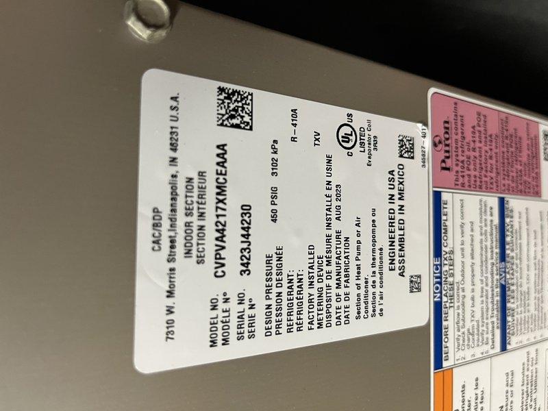 Returned to property for follow-up service call on frozen air conditioning system. Performed diagnostic evaluation of Carrier CVPH series unit that had previously experienced freezing conditions. Measured and documented supply air temperature reading of 51.4°F at supply duct, indicating system is now operating within normal parameters. Verified unit specifications and reviewed equipment data plate information to ensure proper system operation following previous service visit.