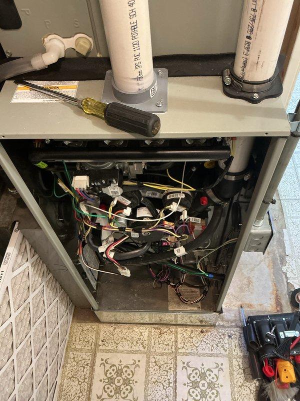 Completed comprehensive cooling system tune-up on ground-level AC unit located at rear of residence. Performed standard preventative maintenance protocol including inspection of internal electrical components, wiring connections, and control boards; all connections found secure with no visible damage. Return air filter showed significant dust and debris accumulation and was noted for replacement to ensure proper airflow and system efficiency. Condensate drainage lines inspected and confirmed operational. Unit exterior panel removed for full access during service and properly reinstalled upon completion.